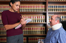 lawyer speaking to her injured client