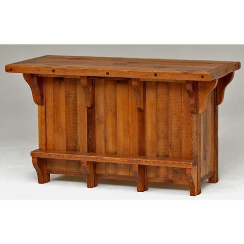 A rustic wooden home bar with vertical plank paneling, a wide countertop, and a built-in footrest on a white background.