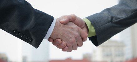 two men shaking hands