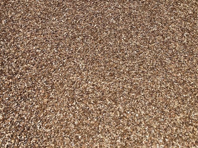 Close-up of a brown and tan speckled textured surface