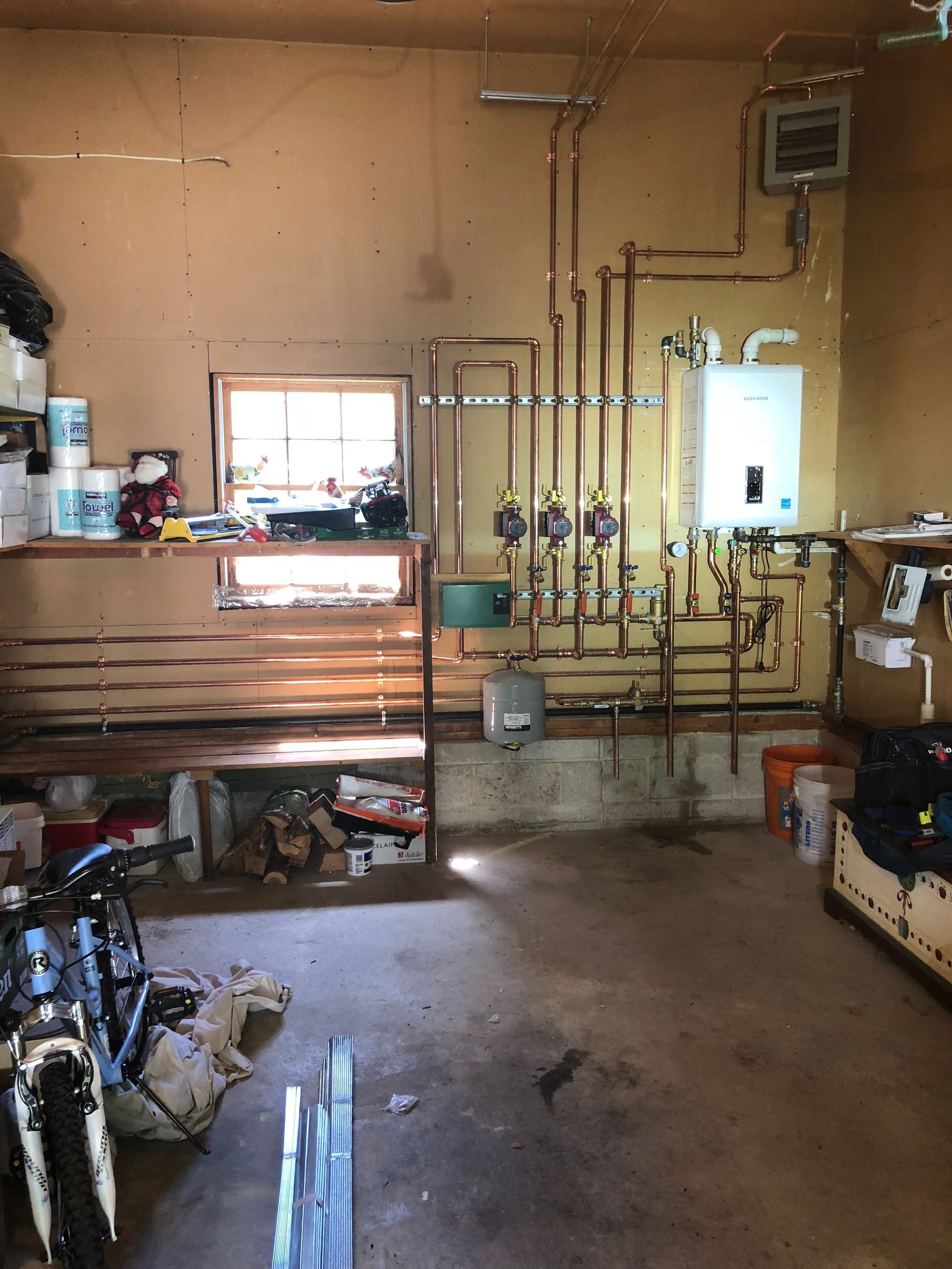 A construction site with a lot of pipes going through it