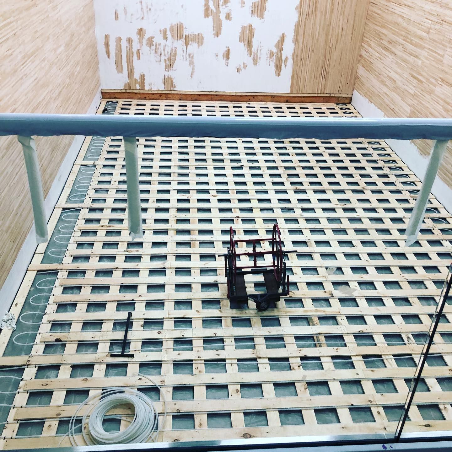 A row of boilers are lined up in a room.