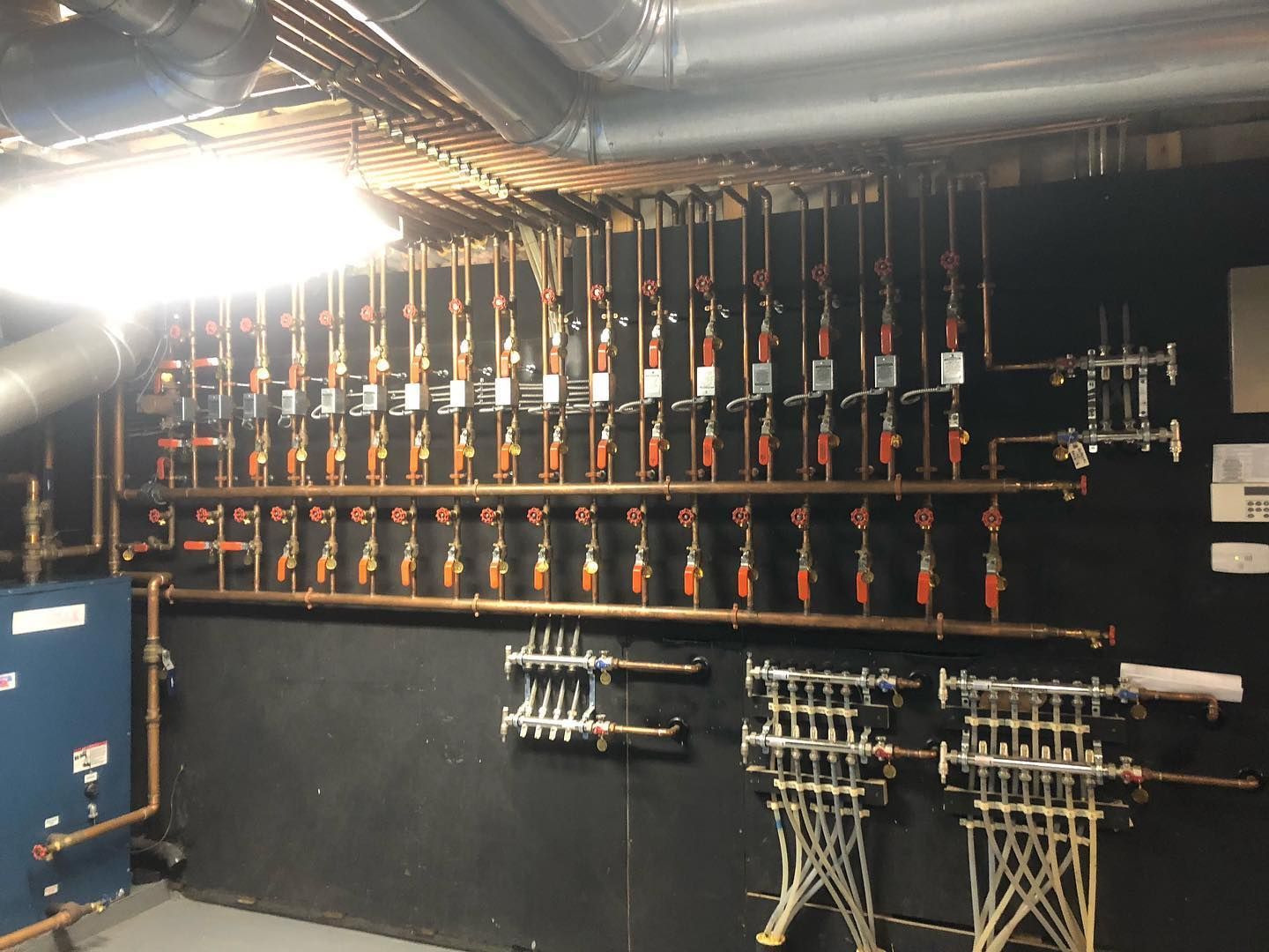 A room filled with lots of pipes and valves.