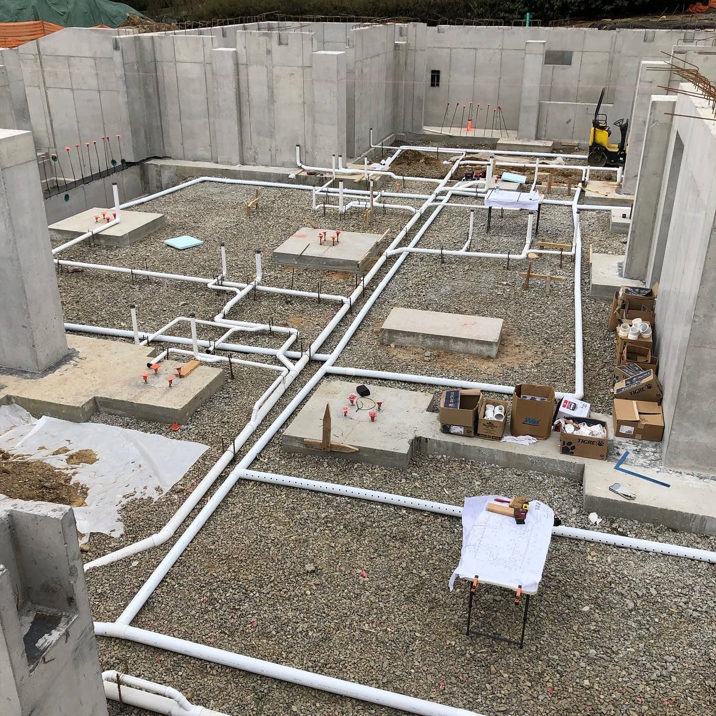 A room with a lot of pipes and a window