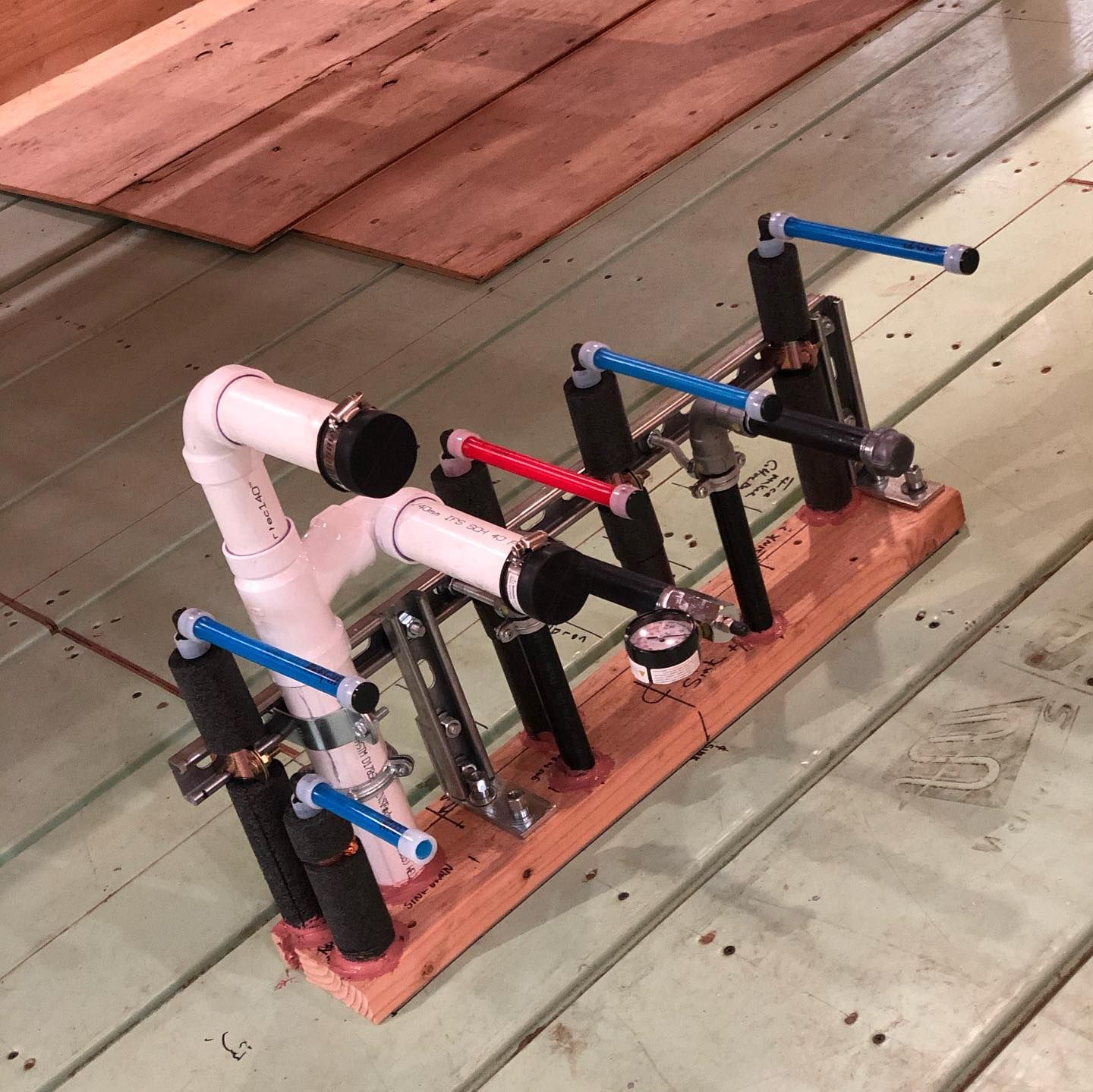 A room with a lot of pipes on the wall