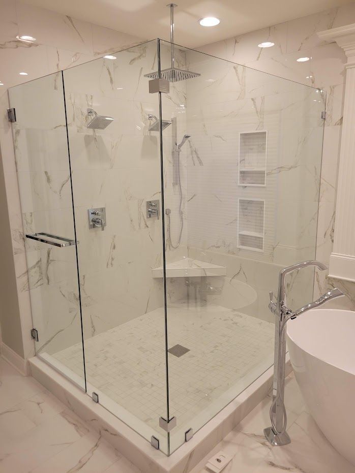 A bathroom with a walk-in shower
