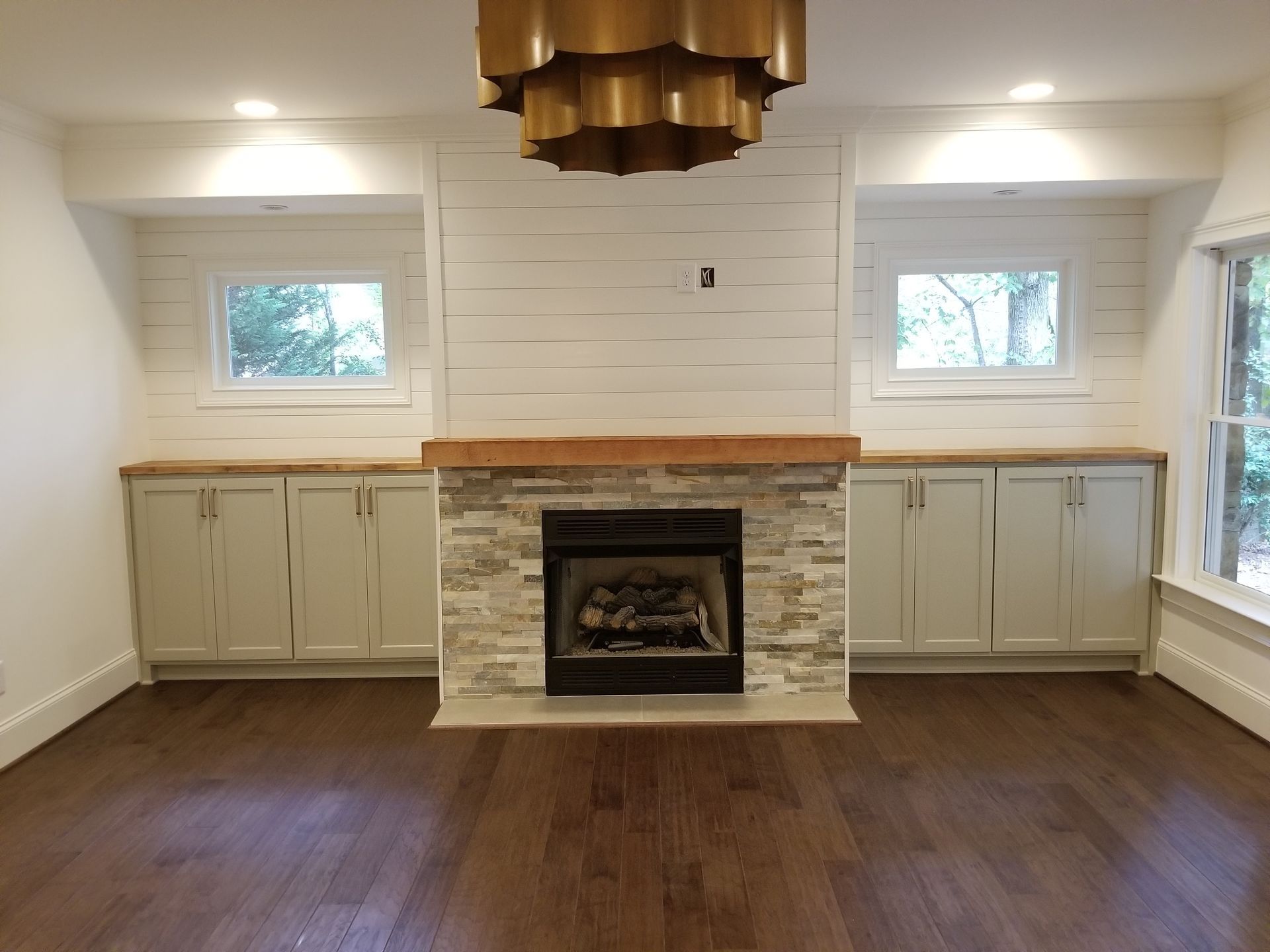 there is a fireplace in the middle of the room .