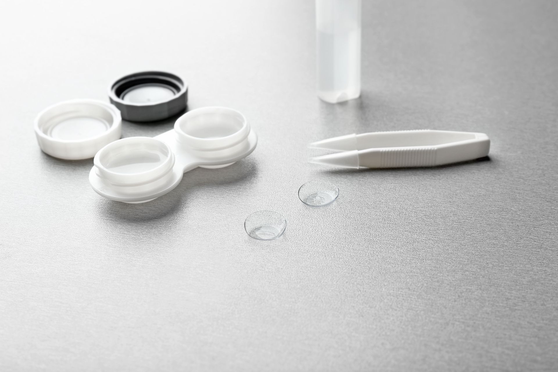 A pair of contact lenses and container