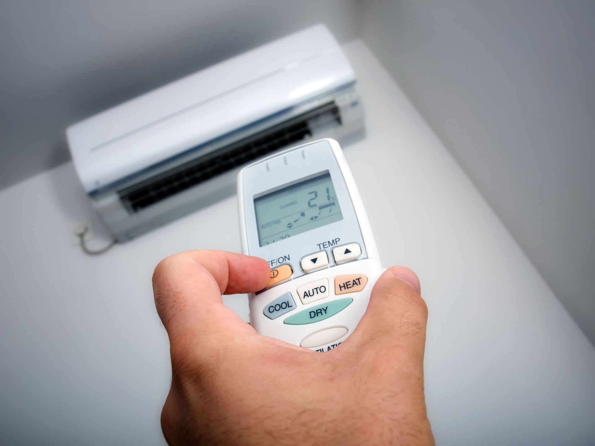 A group of air conditioners and a thermostat on a white background.