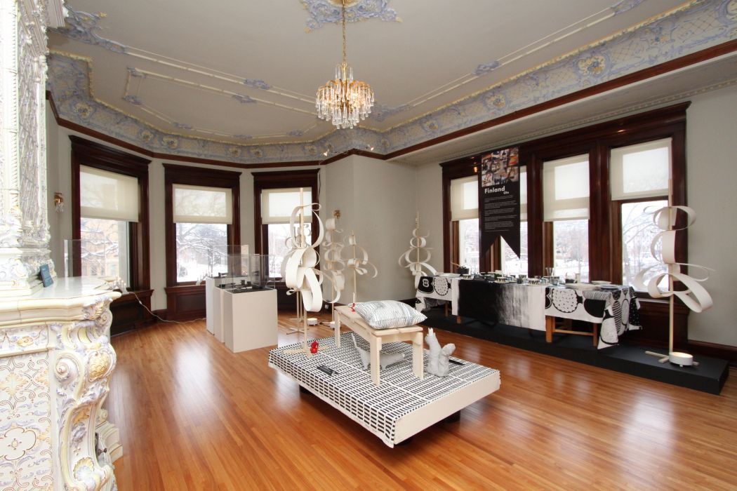 A large room with a lot of windows and a table in the middle of the room.