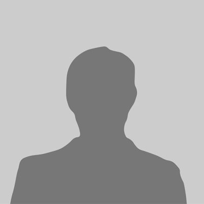 Silhouette of a person against a gray background; shows shoulders and head, likely a portrait placeholder.