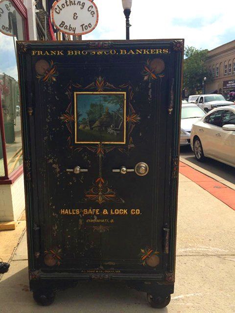 Large metal safe placed on the sidewalk