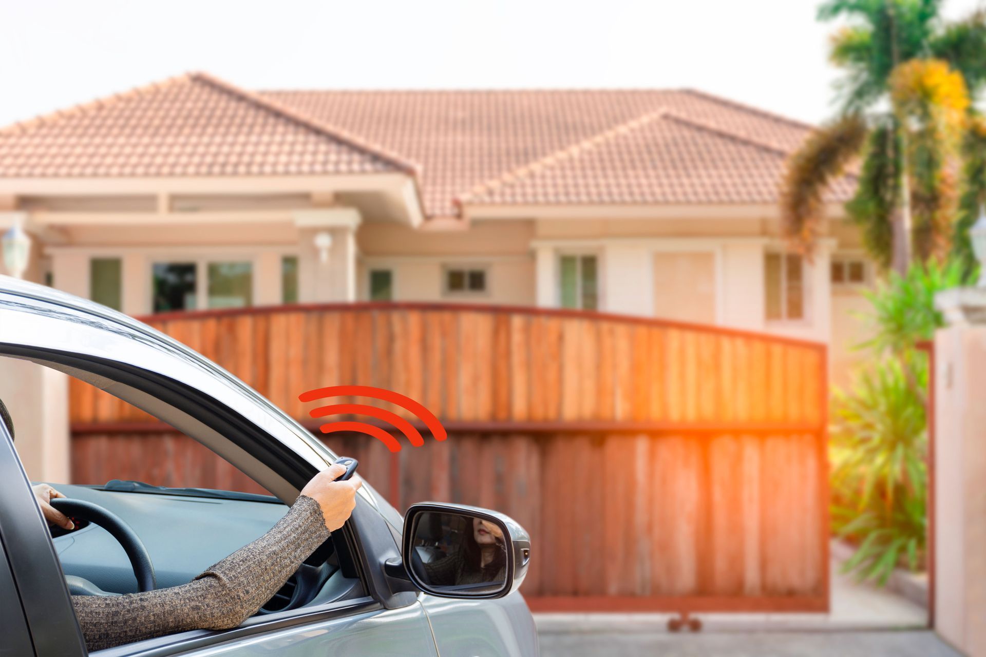 Car with driver near a suburban home gate, red motion lines showing the horn is sounding