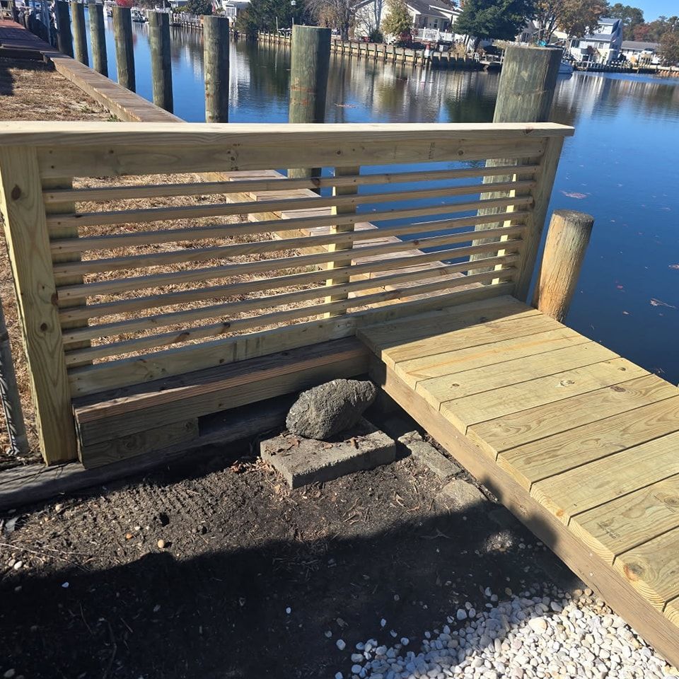 A wooden dock with a fence around it