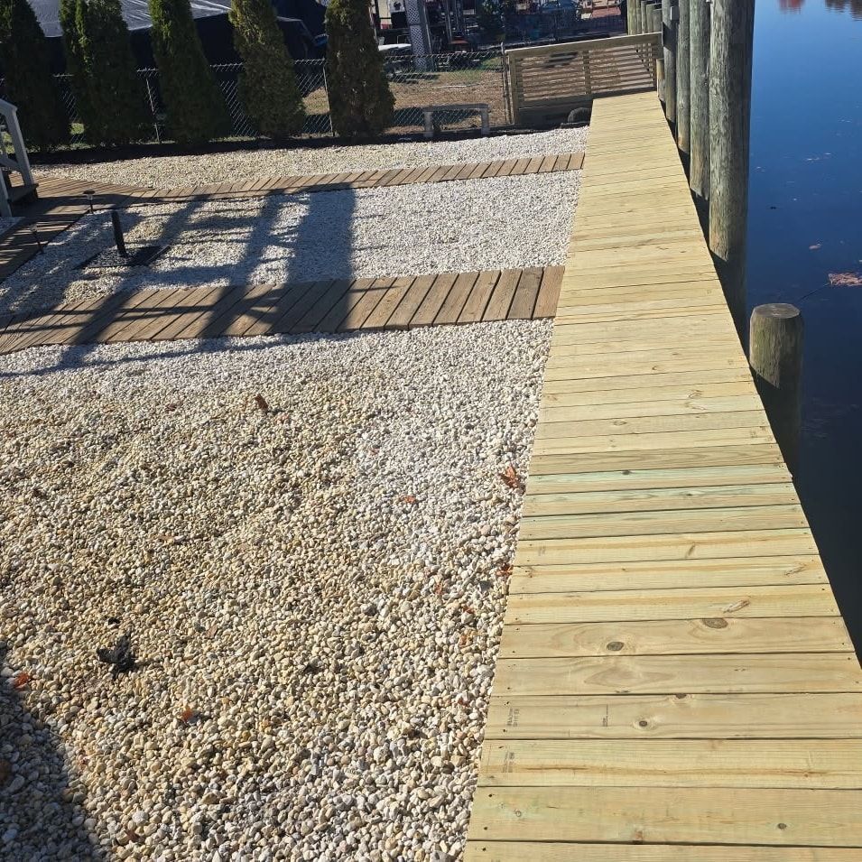 A wooden dock is next to a body of water
