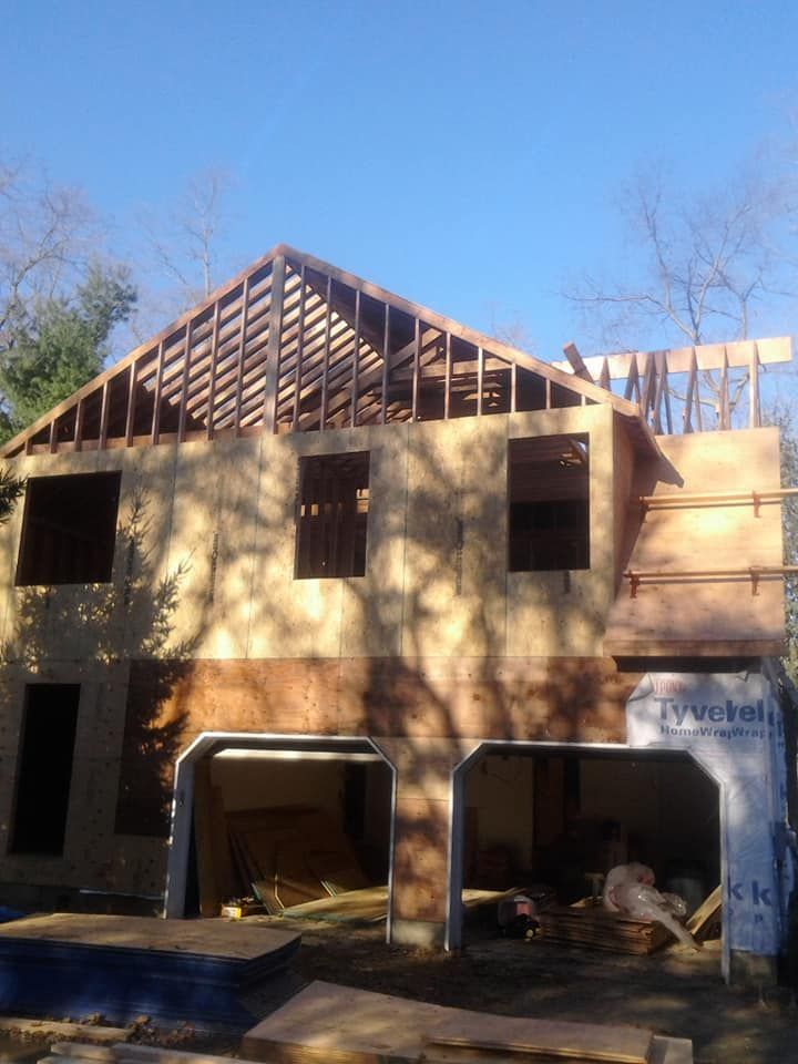 A house that is being built with styrofoam on the side