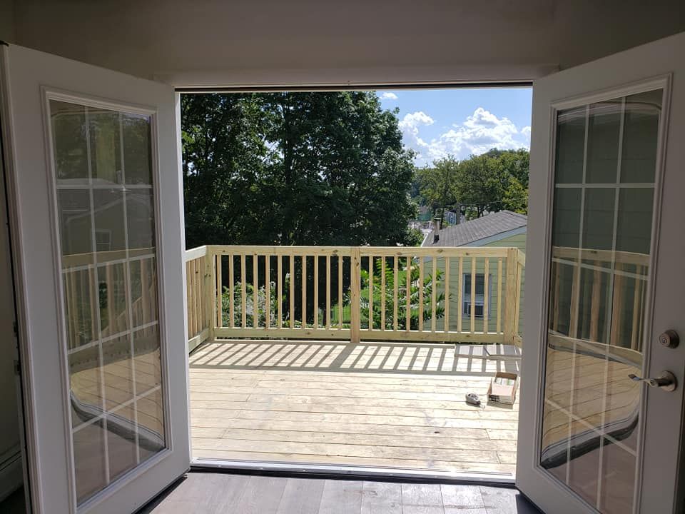 A view of a deck from inside a house.