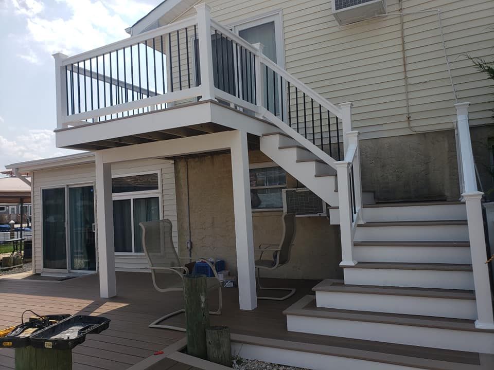 There is a deck with stairs leading up to it.