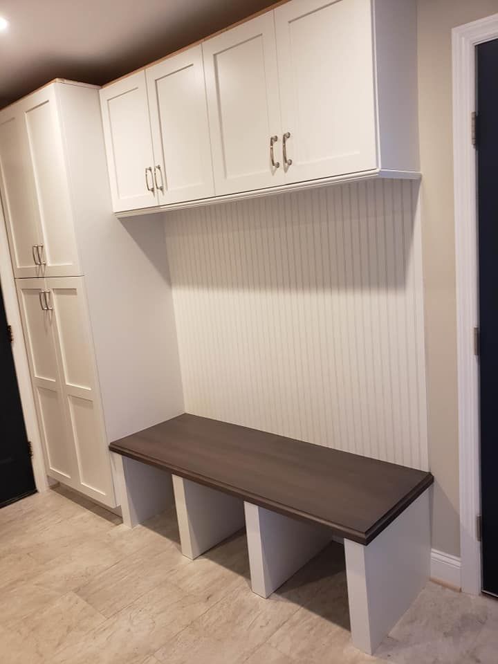 There is a bench in the middle of the room.