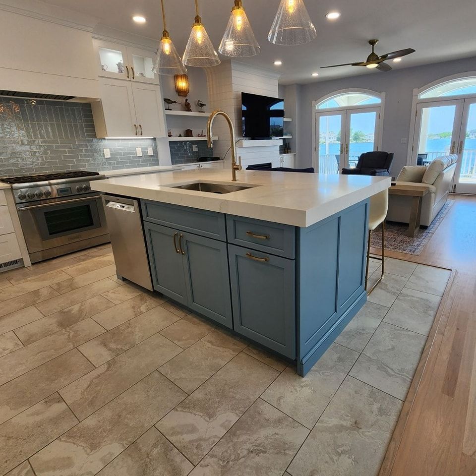 A kitchen with a large island and a sink