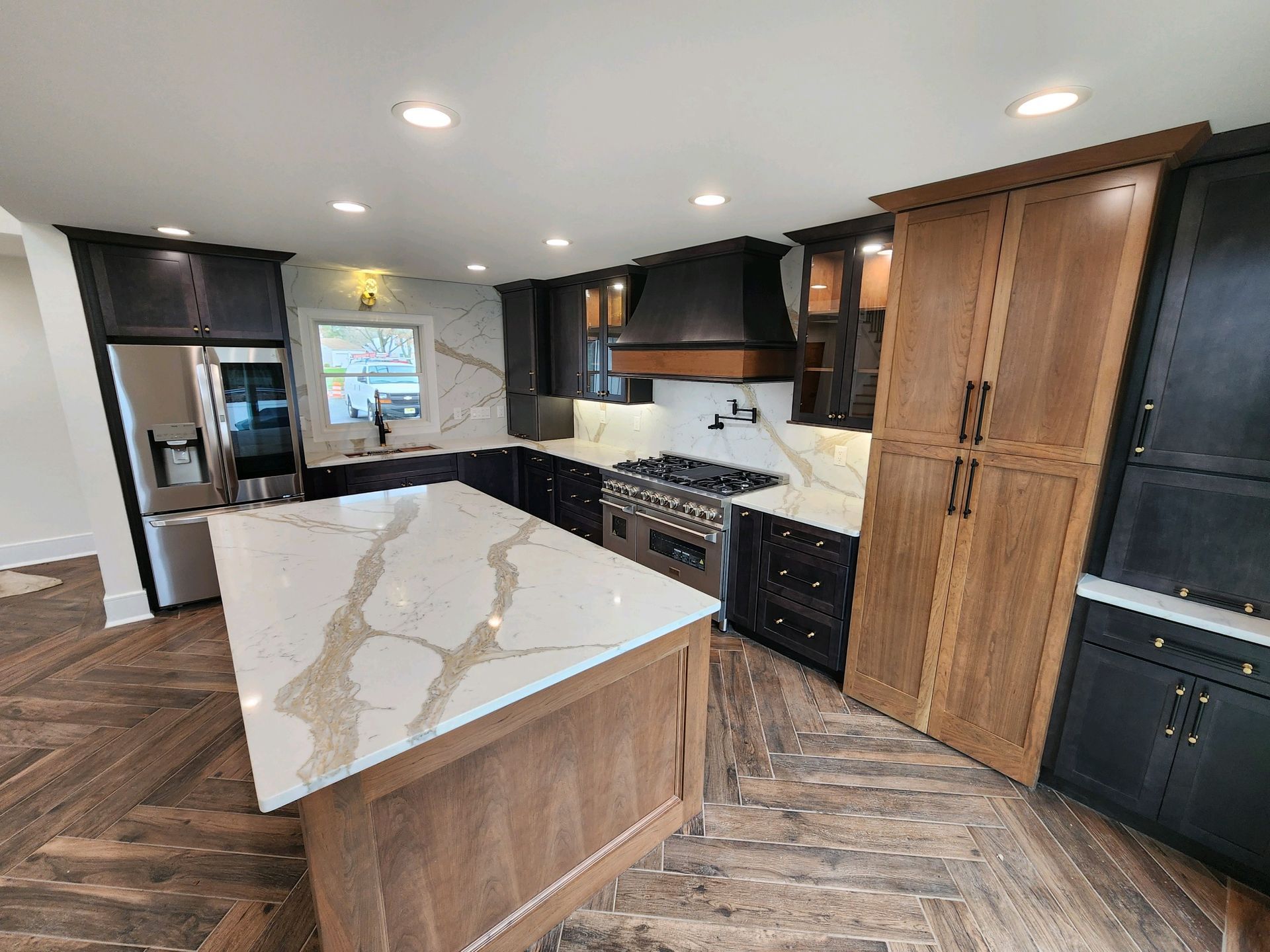 A kitchen with a large island in the middle of it