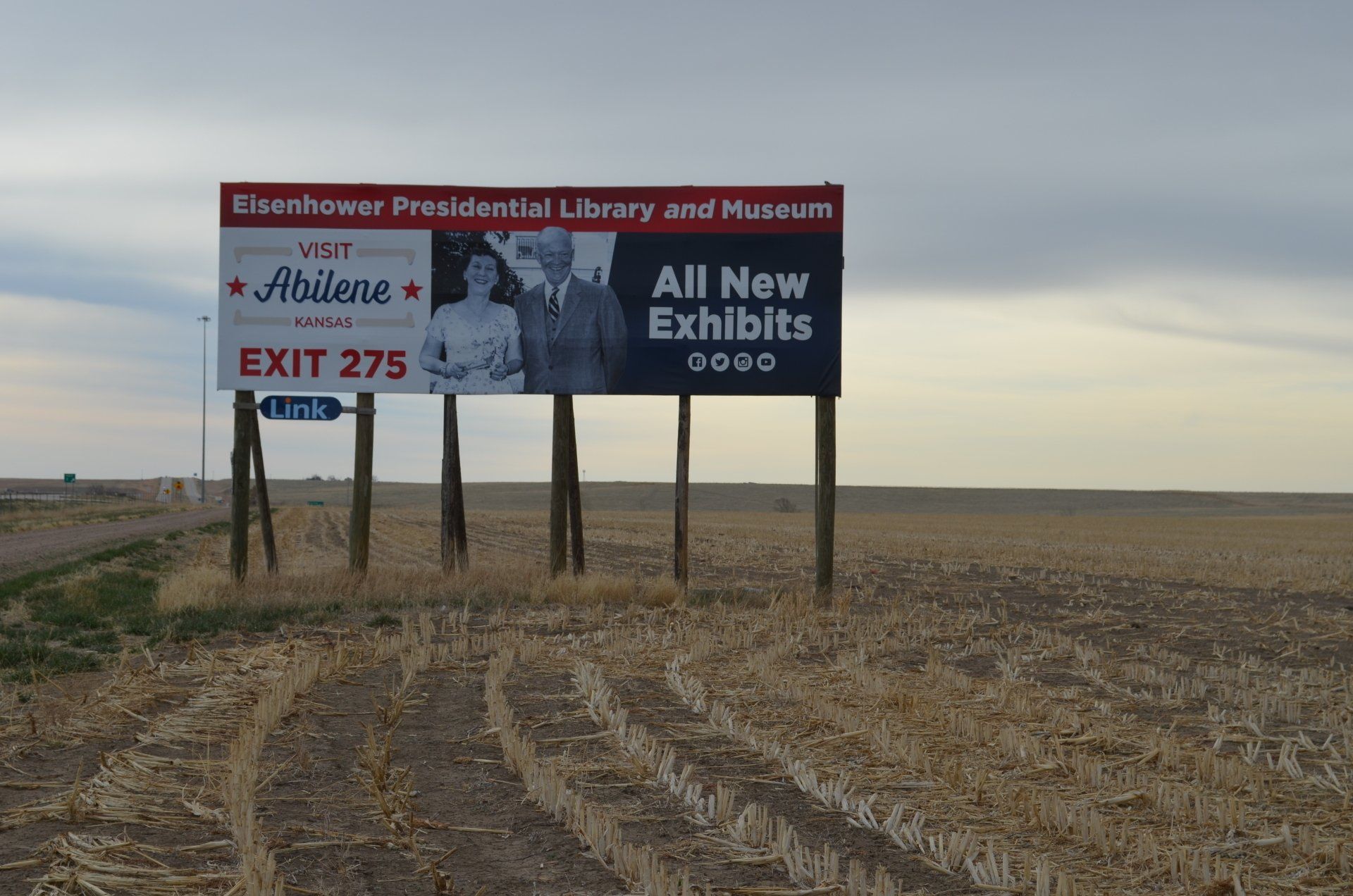 A billboard that says all new exhibits on it