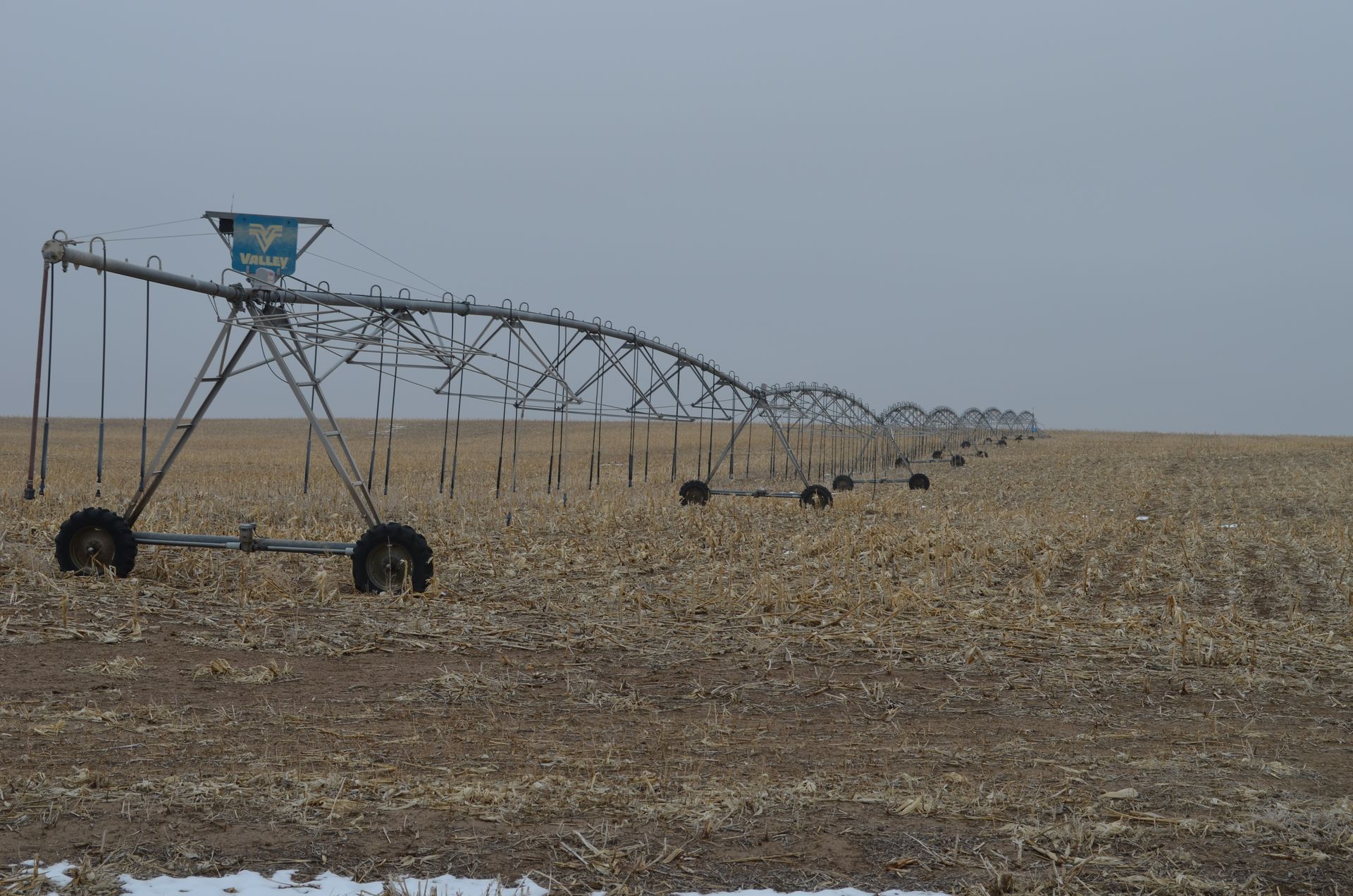 A large irrigation system is in the middle of a field