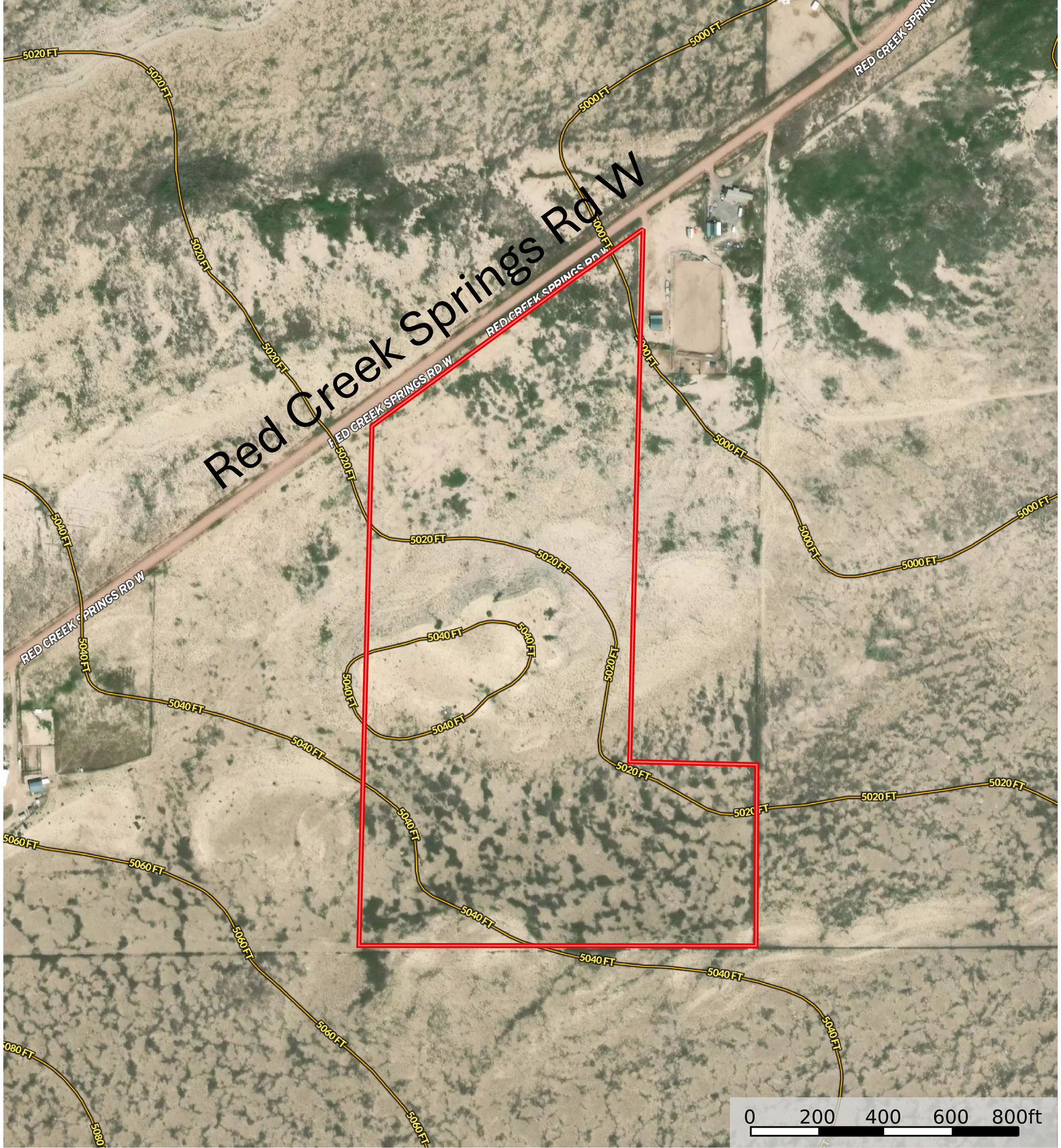 Aerial view of a parcel of land bordered in red, next to Red Creek Springs Rd.
