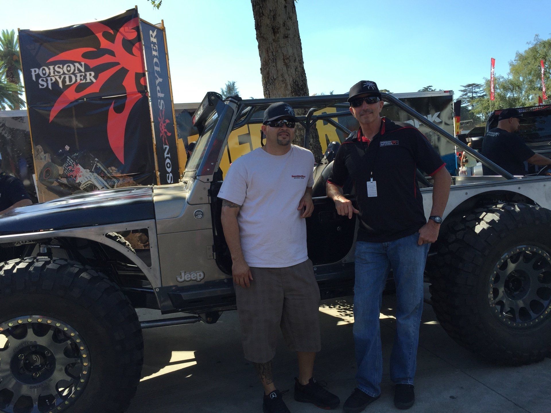 Men standing next to a vehicle