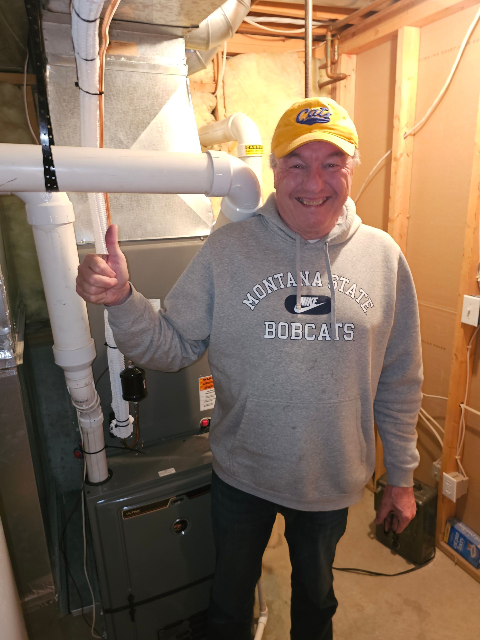 A man standing in front of a furnace