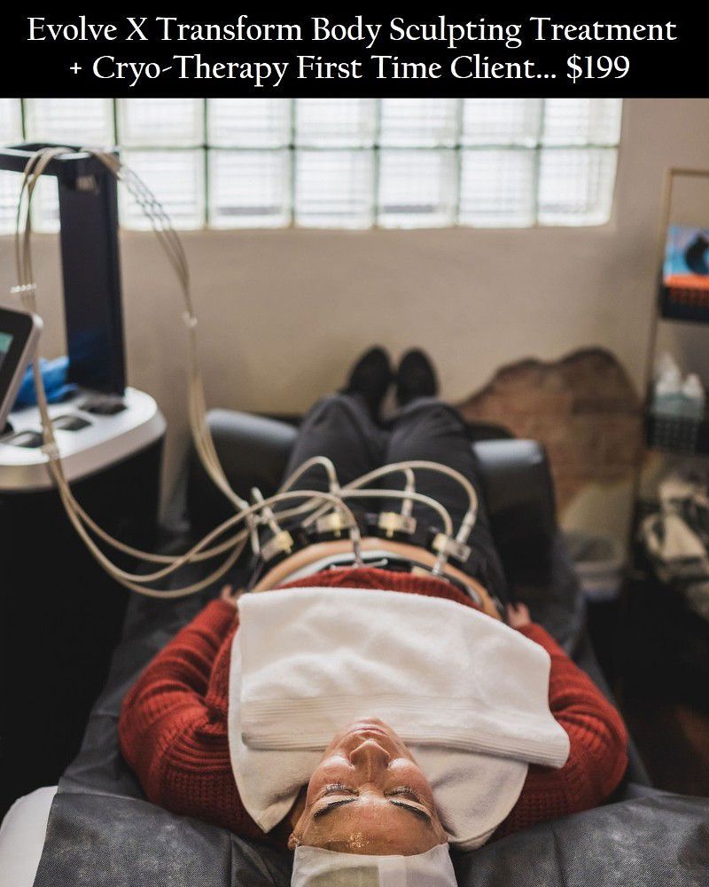 A woman is laying on a bed getting a body sculpting treatment