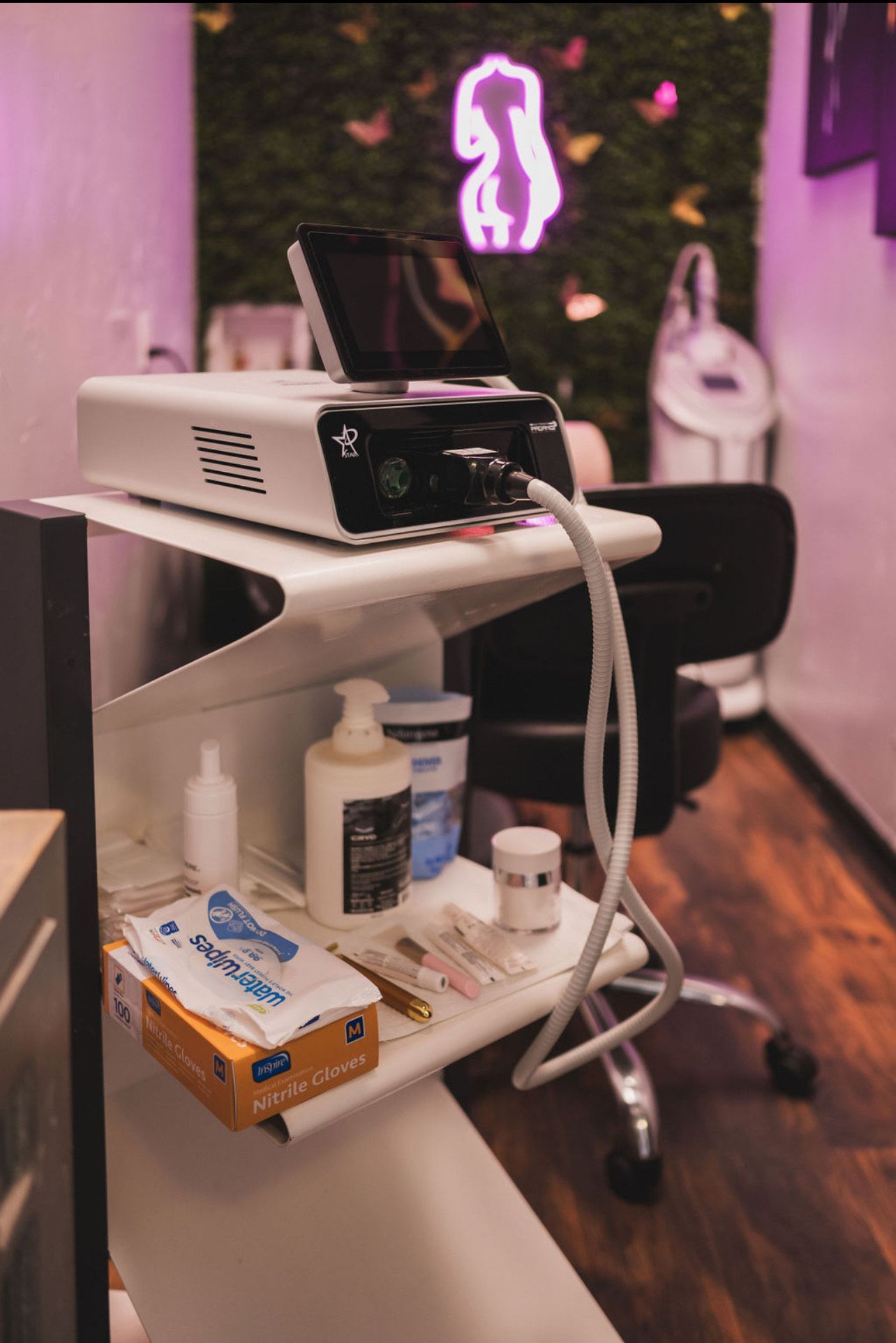 A machine is sitting on top of a shelf in a room.