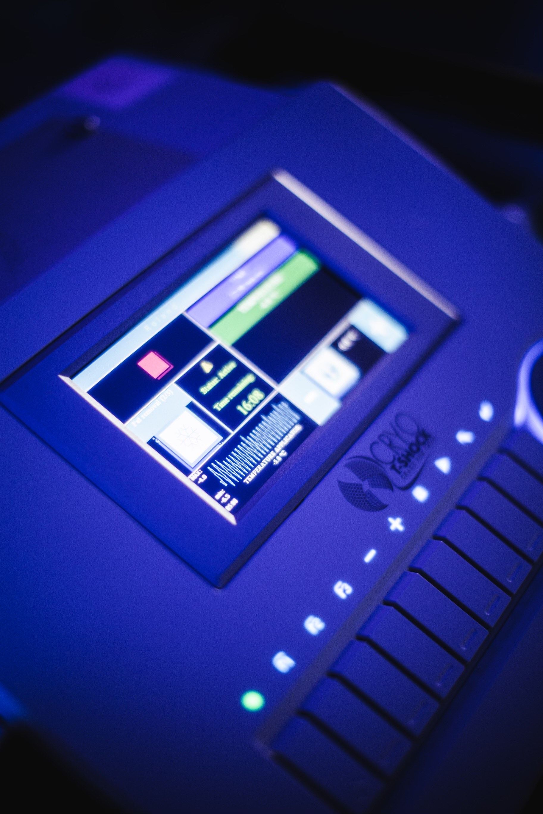 A close up of a keyboard with a blue screen