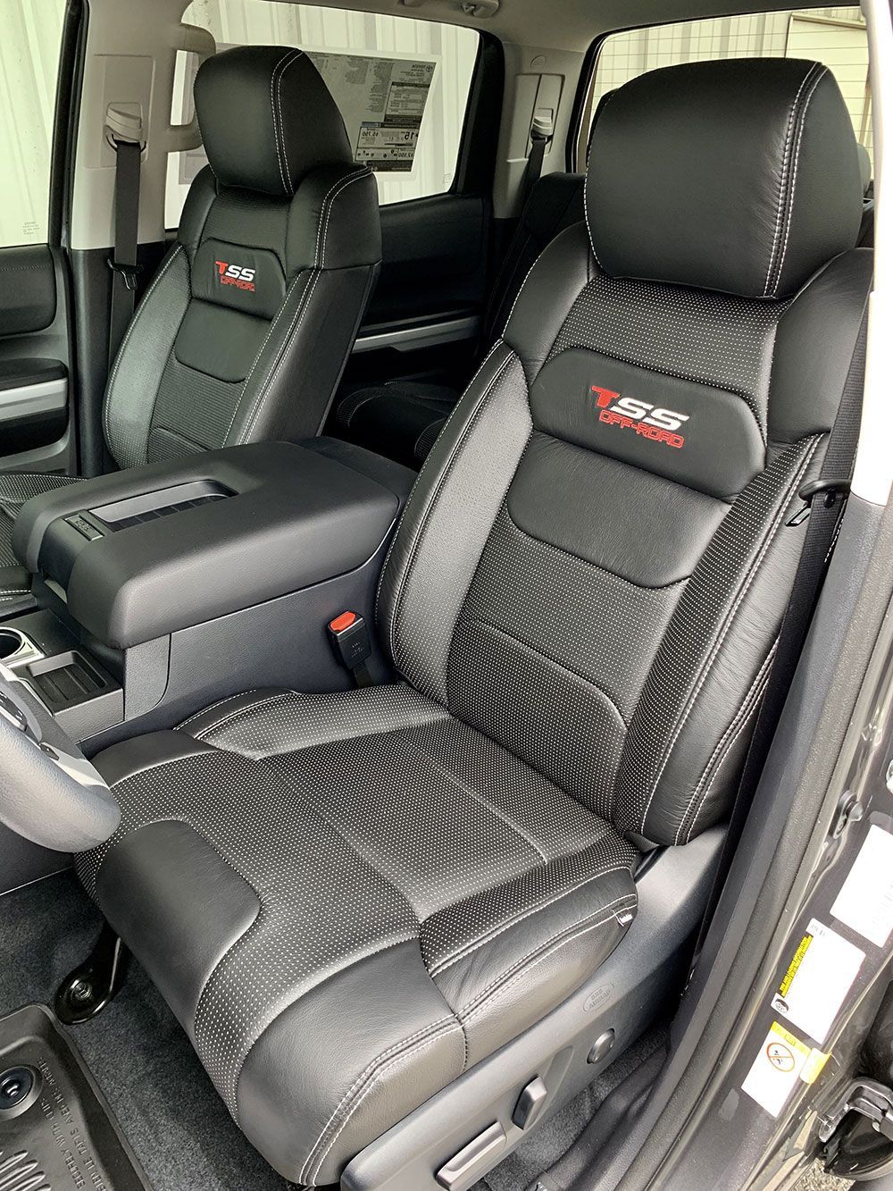 Black leather truck seats with red 