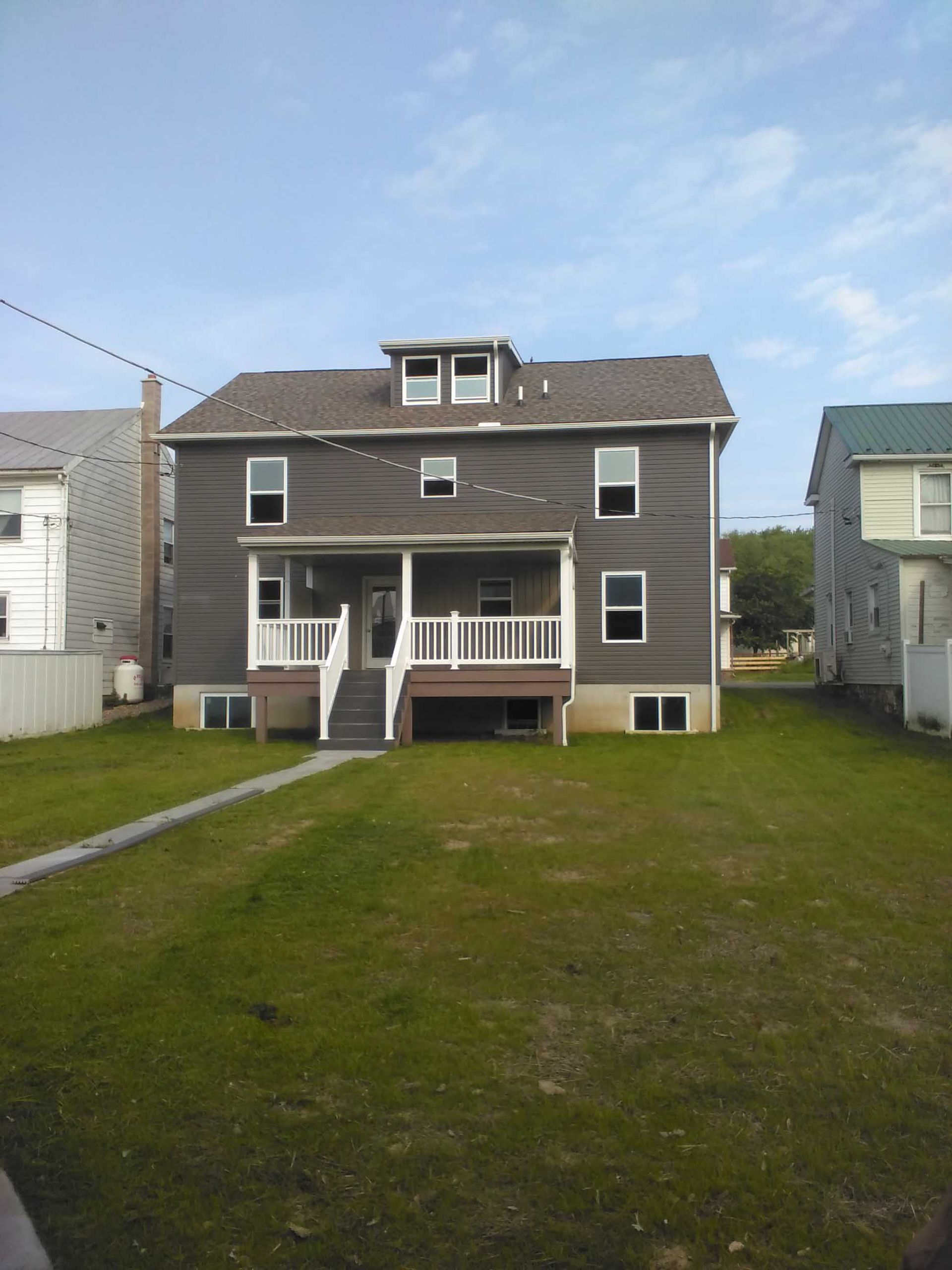 A large house with a large lawn in front of it