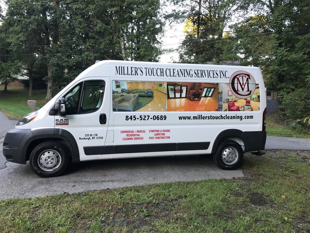 A white Miller’s Touch Cleaning Services van parked on the side of a road, displaying contact info and service photos.