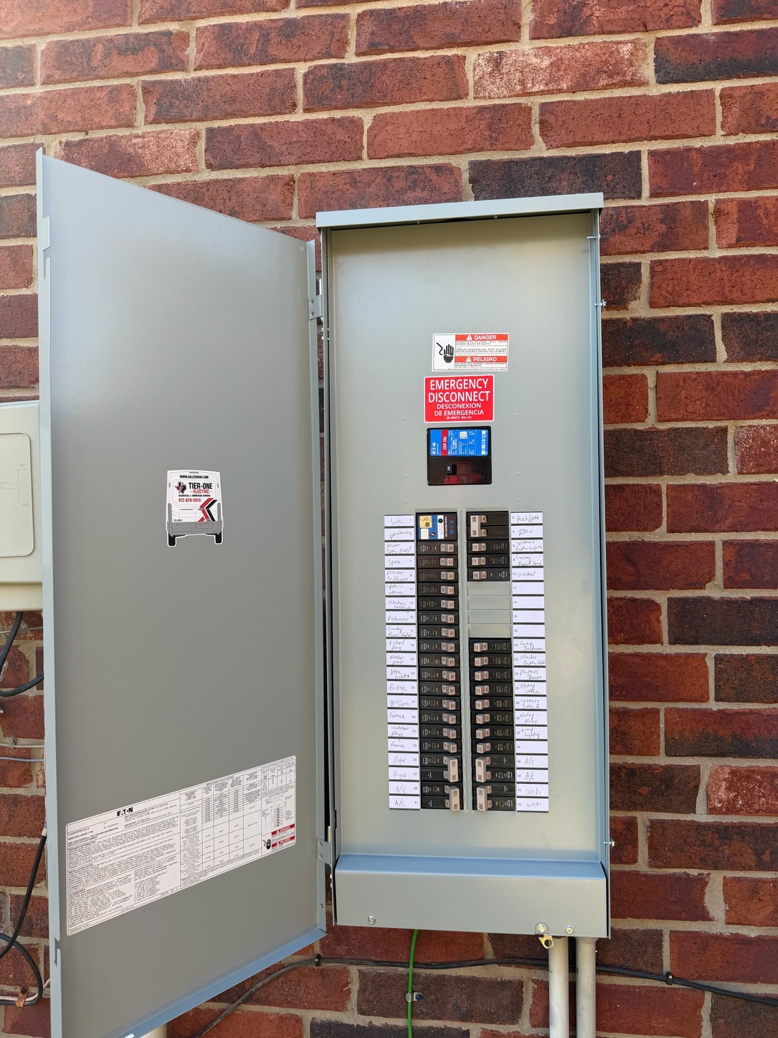 Completed outdoor residential electrical panel replacement with labeled circuit breakers by Tier-One Electric.