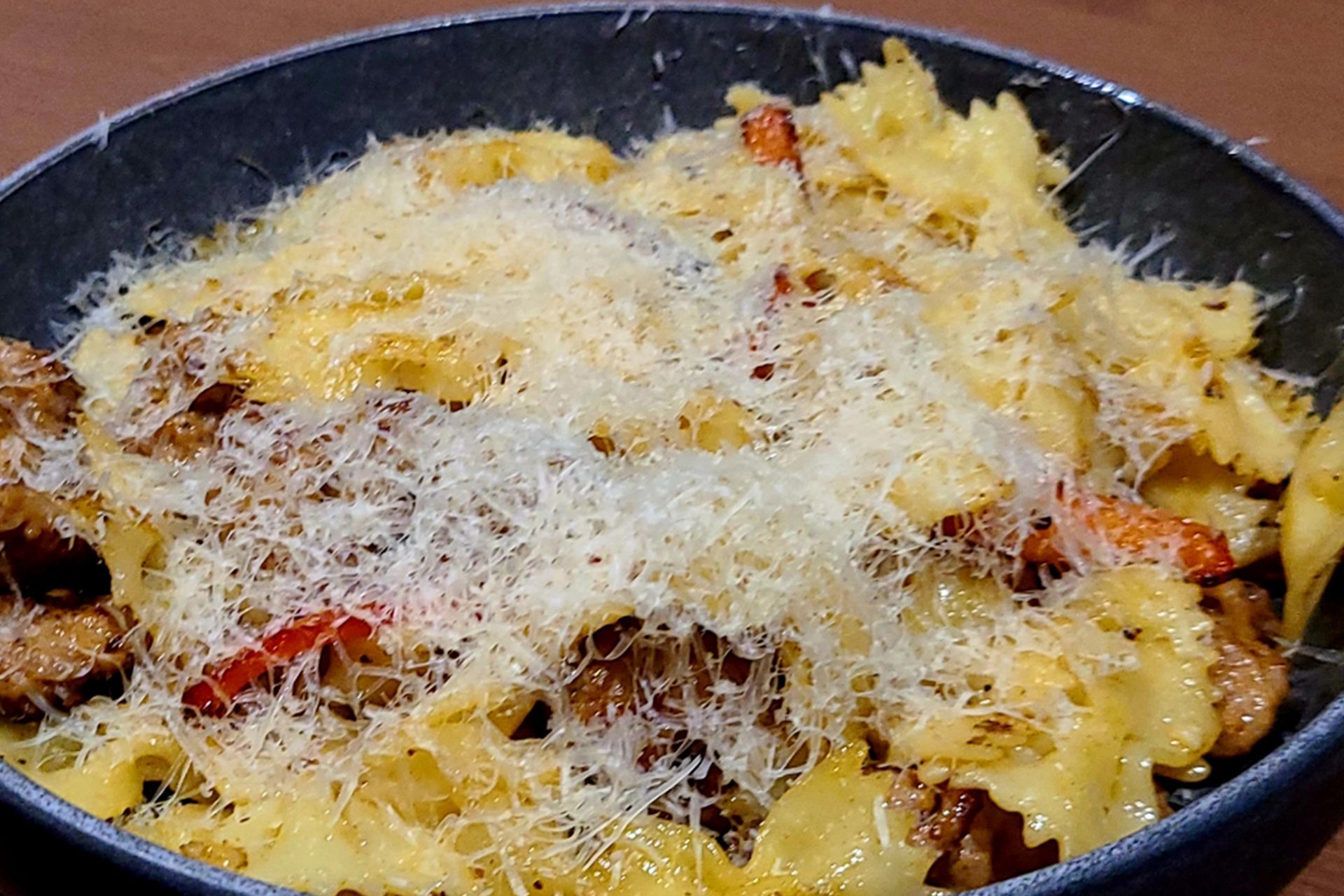 A close up of a pasta dish with cheese on top