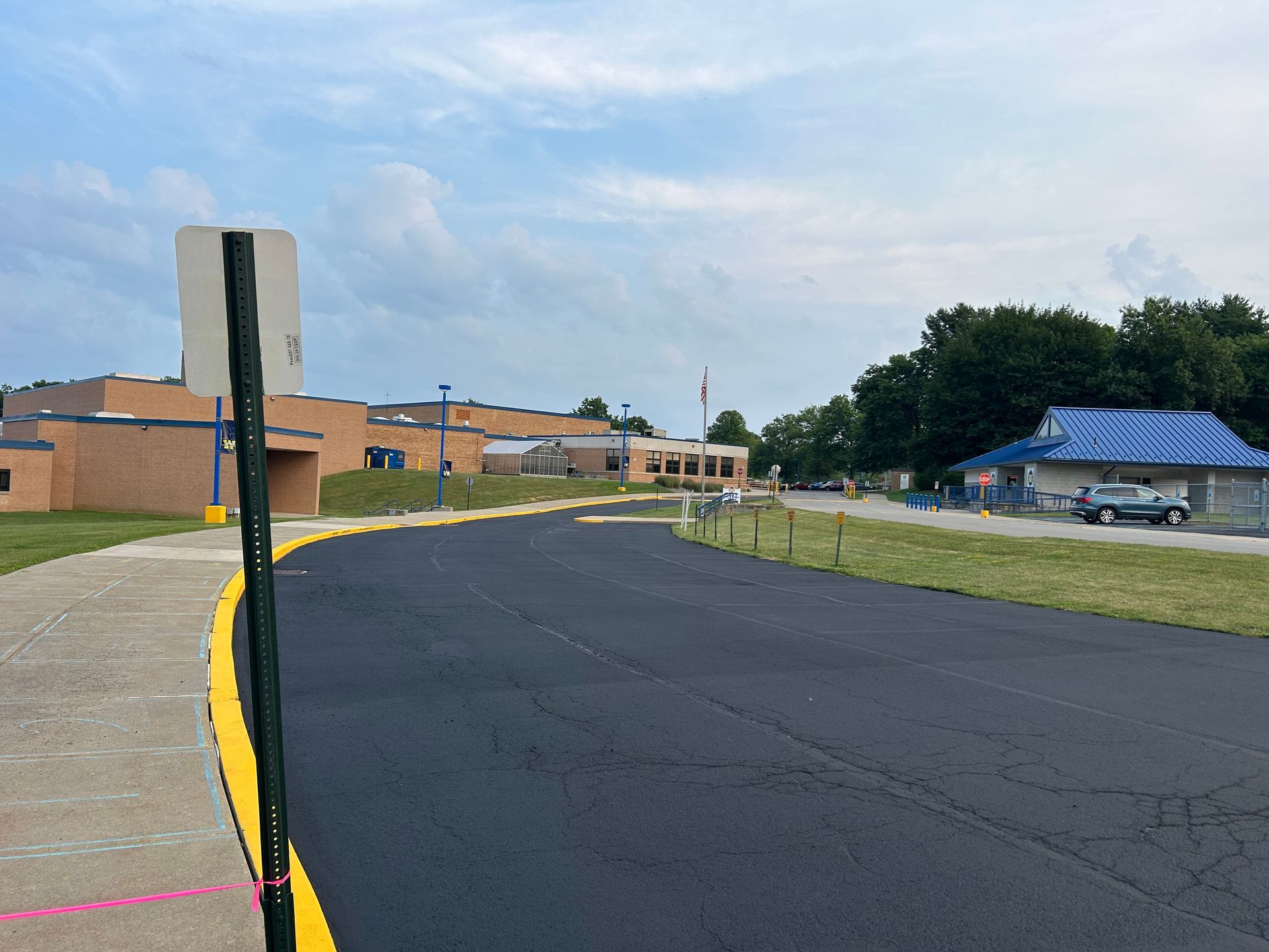 A road with a stop sign on the side of it