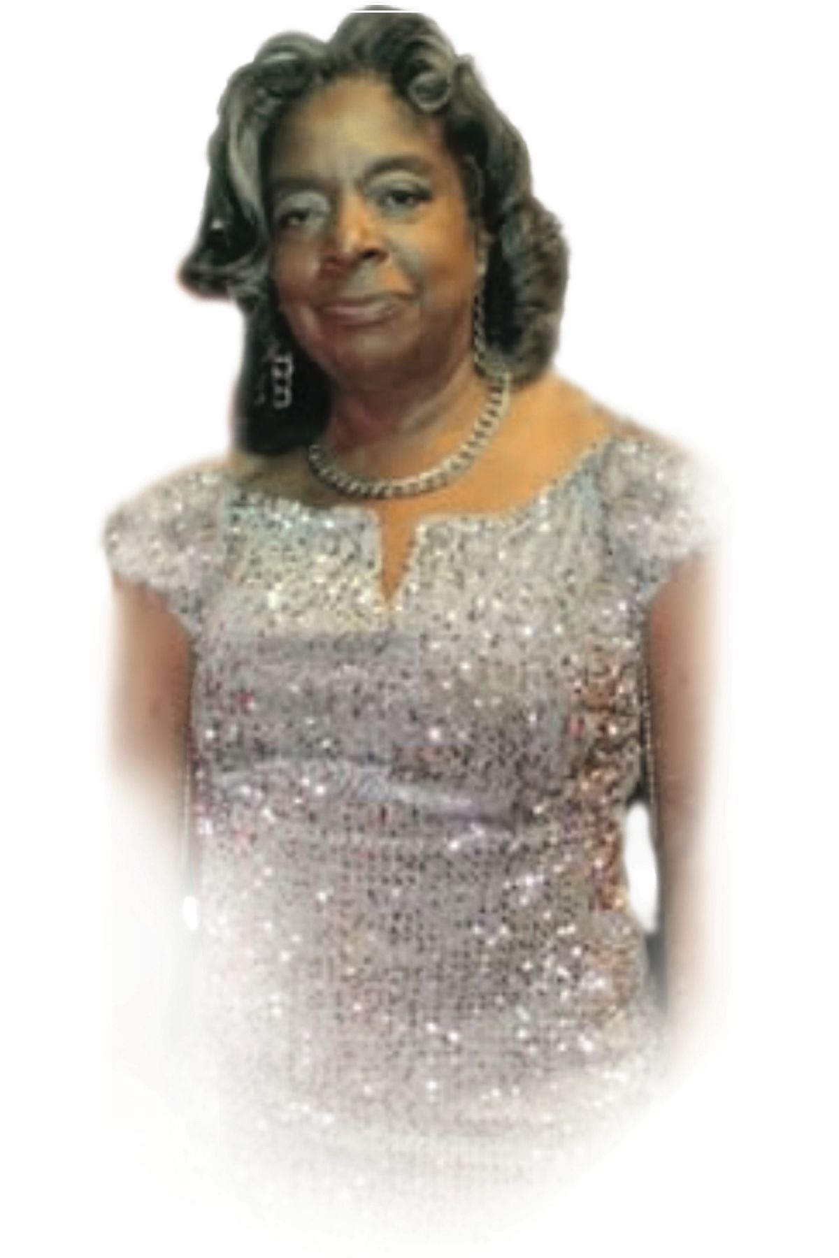 Woman in a sparkly silver dress, smiling against a white background.