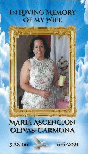 Memorial tribute with portrait in gold frame, blue sky background, and dates 5-28-66 and 6-6-2021.