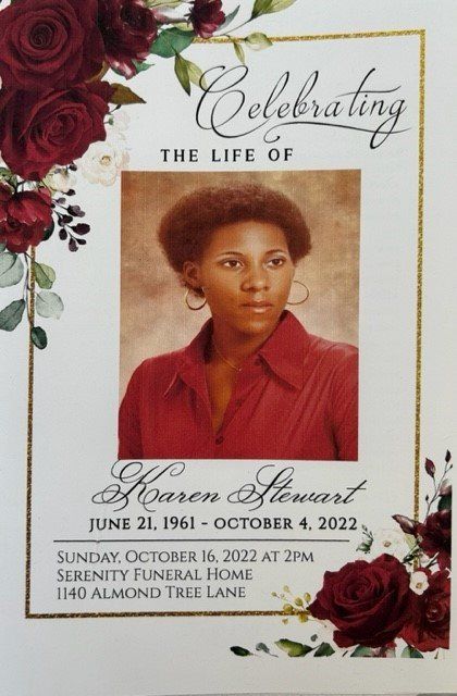 Memorial program cover with a portrait, red roses, and gold border for Karen Stewart, Oct. 16, 1961–Oct. 2, 2022.
