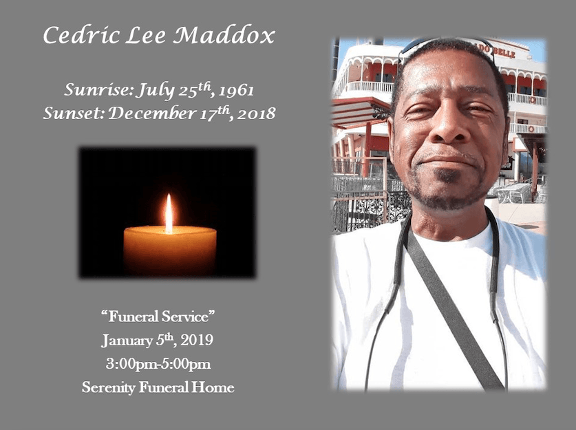 Memorial card with portrait, lit candle, and text: Cedric Lee Maddox, sunrise and sunset dates.