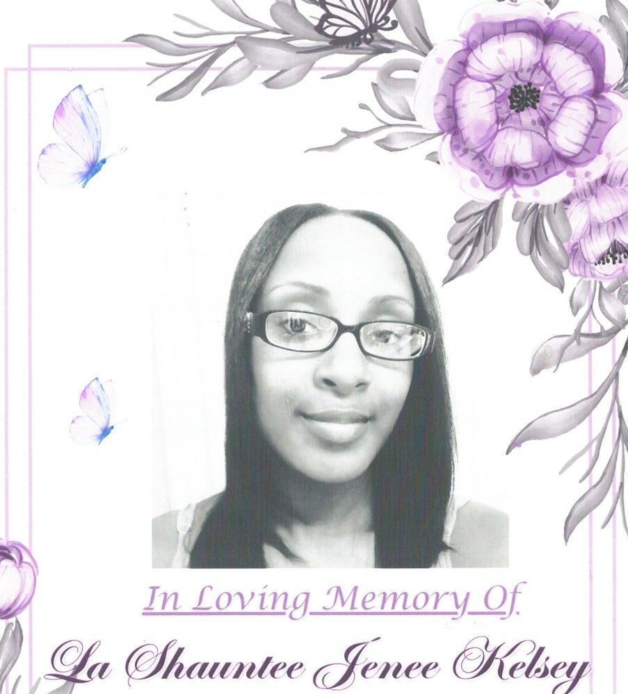 Memorial portrait with purple floral border and text: “In Loving Memory Of La Shaunnee Jenee Kelsey”