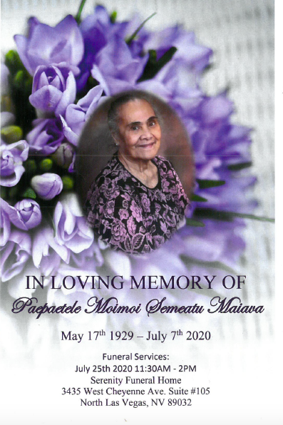 Memorial card with purple flowers and an oval portrait of an elderly woman, honoring a loved one.