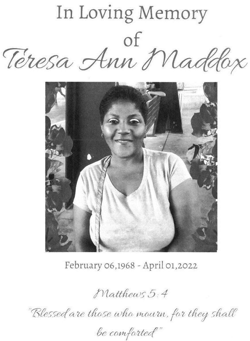 Memorial poster with portrait, “In Loving Memory” and the name Teresa Ann Maddox.