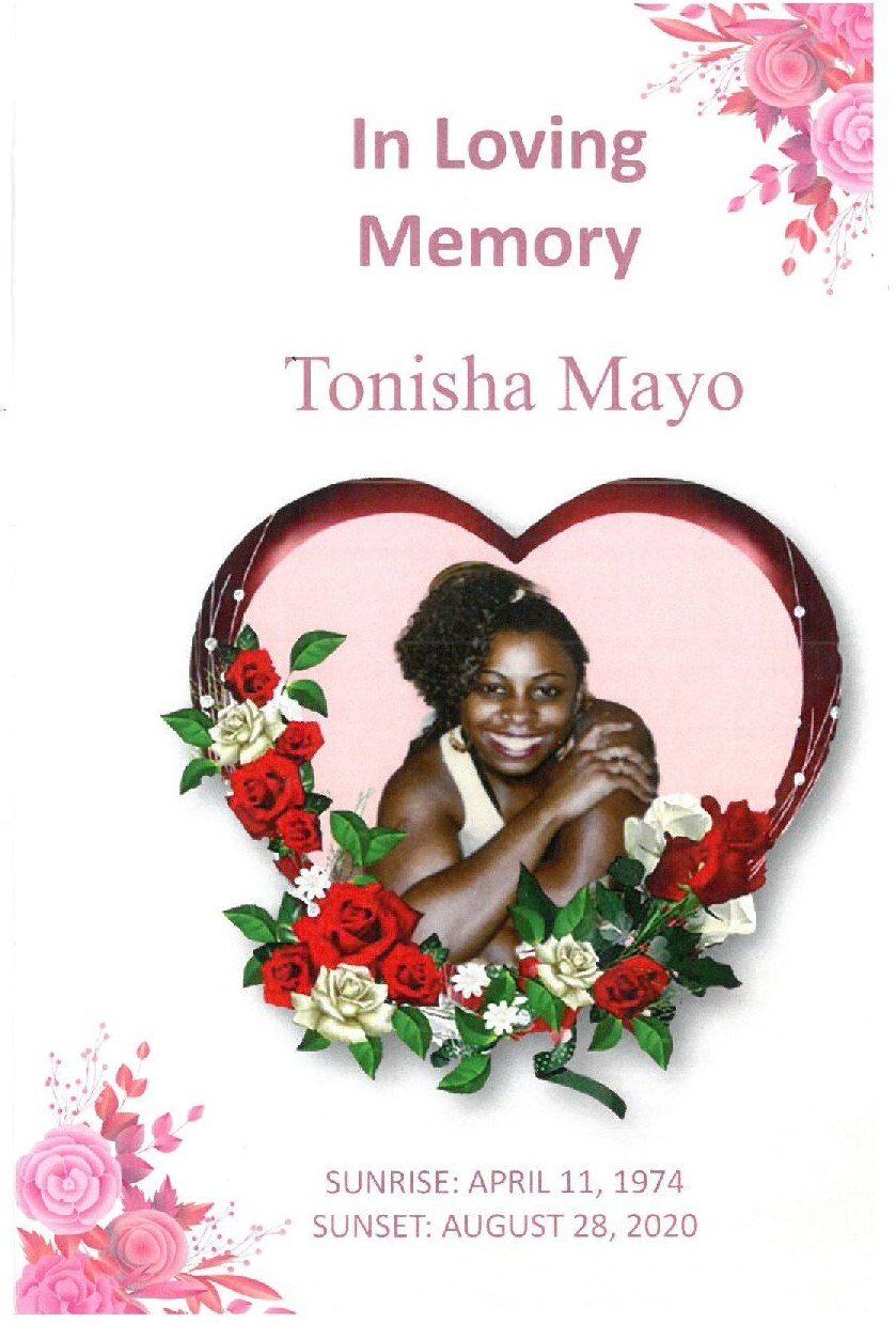 In loving memory memorial card with pink flowers and a heart-framed portrait of Tonisha Mayo