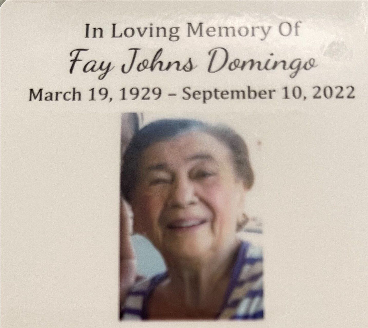 Memorial card reading “In Loving Memory Of Fay Johns Domingo” with a smiling portrait and dates, March 19, 1929–September 10, 2022