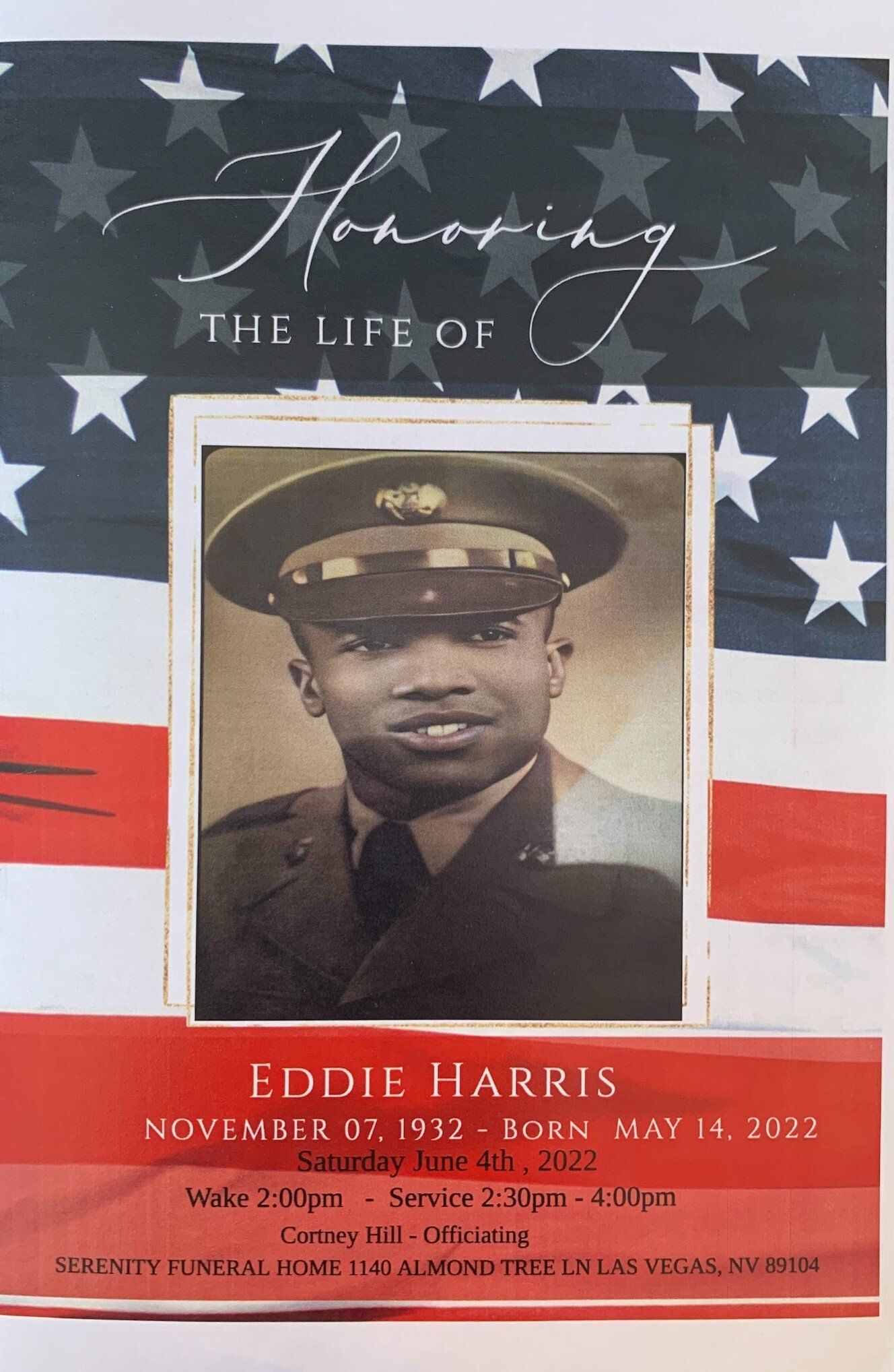 Memorial program for Eddie Harris with a black-and-white portrait over a U.S. flag background