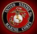 United States Marine Corps emblem with eagle, globe, and anchor on a red circular seal